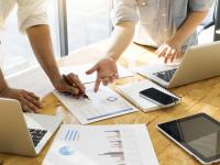 Business people meeting to discuss the situation on the market.